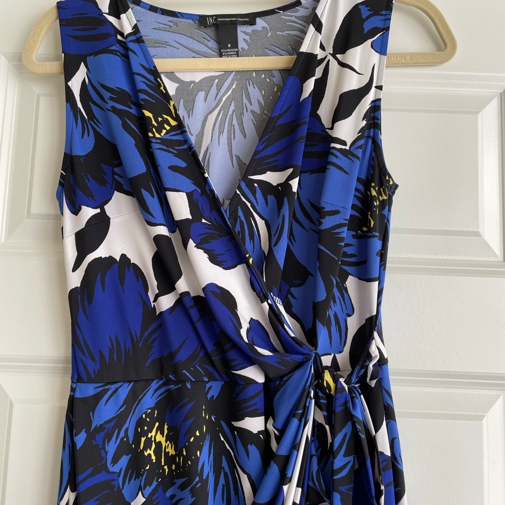Gorgeous jersey knit faux wrap dress. Gently worn. Bold bright floral. Small